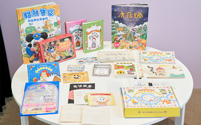 信子除了單純的繪本創作，也可以將「遊戲書」概念注入繪本中。