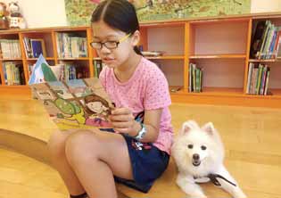 參加者共同分享寵物陪讀的喜悅。( 新北市立圖書館新莊裕民分館提供)